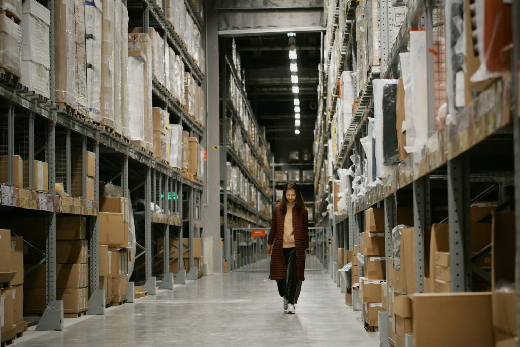 Girl walking in Warehouse, ERP(Enterprise Resource Planning) System in Singapore